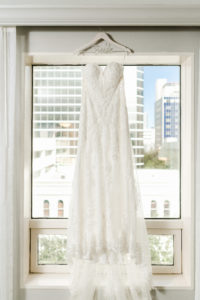 Wedding Dress Hanger Shot | White Lace Sweetheart Neckline Strapless Sheath Wedding Dress Bridal Gown Hanging in Window