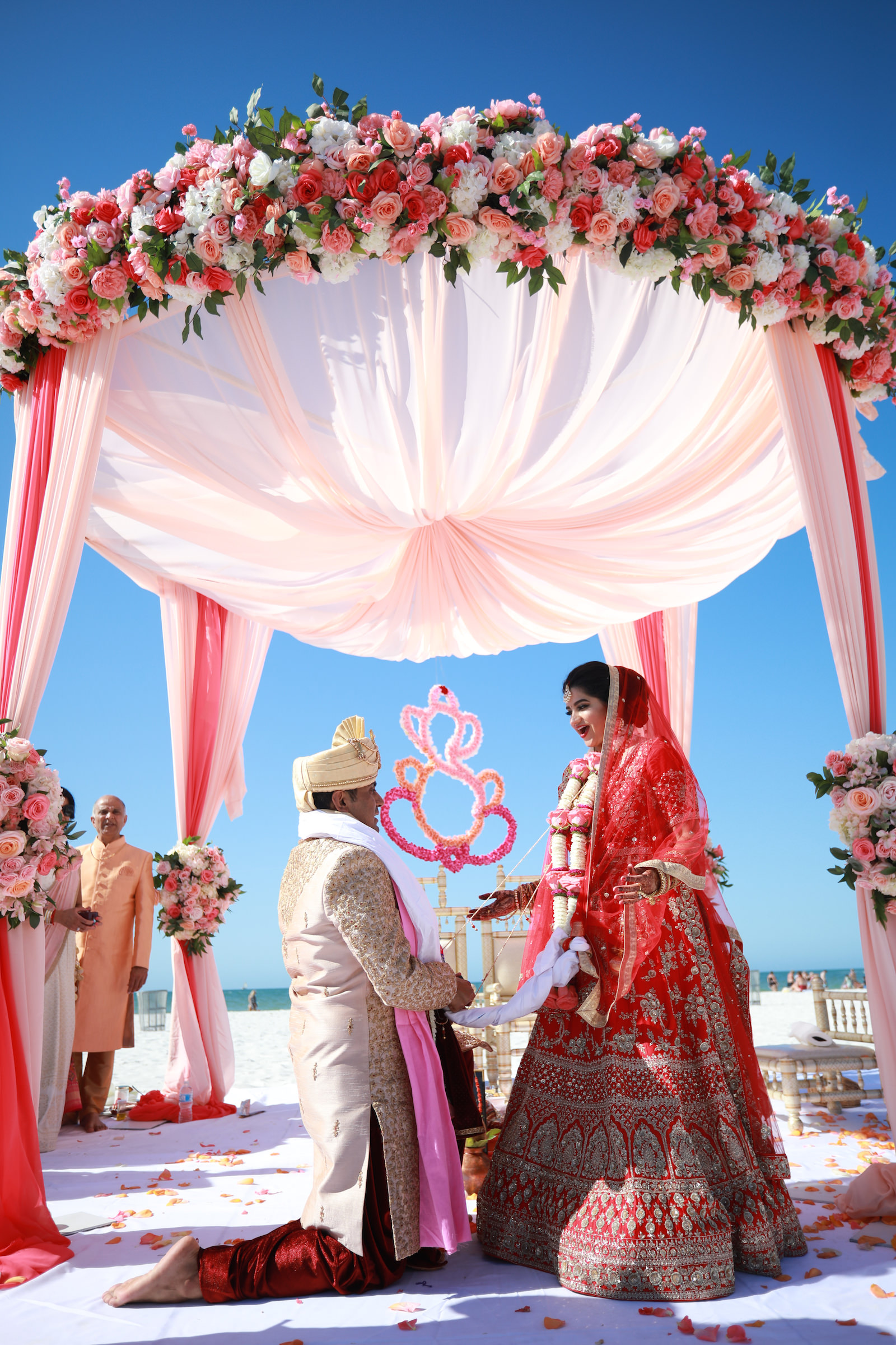 Tampa Clearwater Beach Indian Wedding Mandap with Pink and Coral Draping and Pink Peach Coral Roses