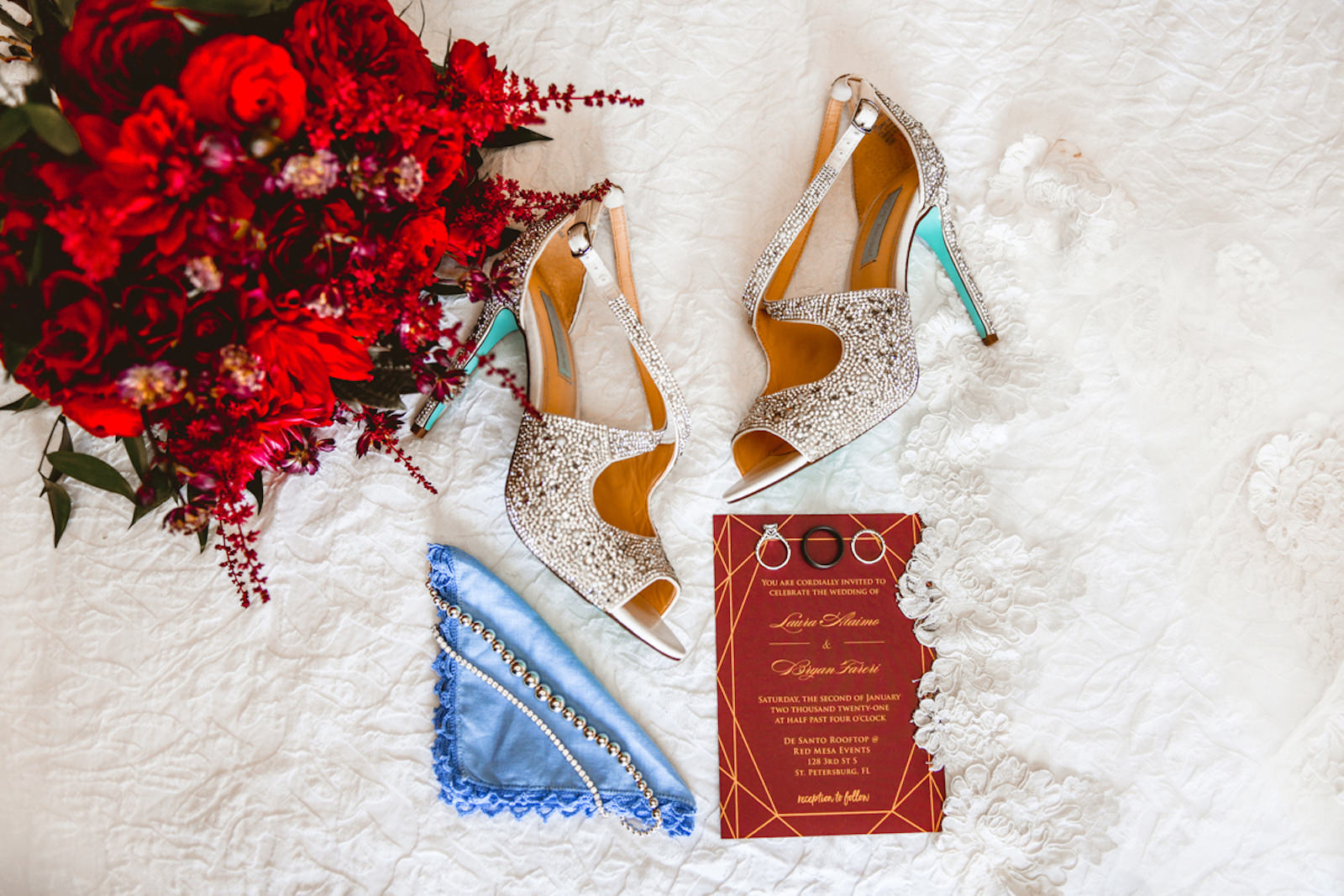 Burgundy Red and Gold Geometric Pattern Wedding Invitation, Silver Rhinestone Shoes with Tiffany Blue Bottoms, Blue Handkerchief, Red Floral Bouquet