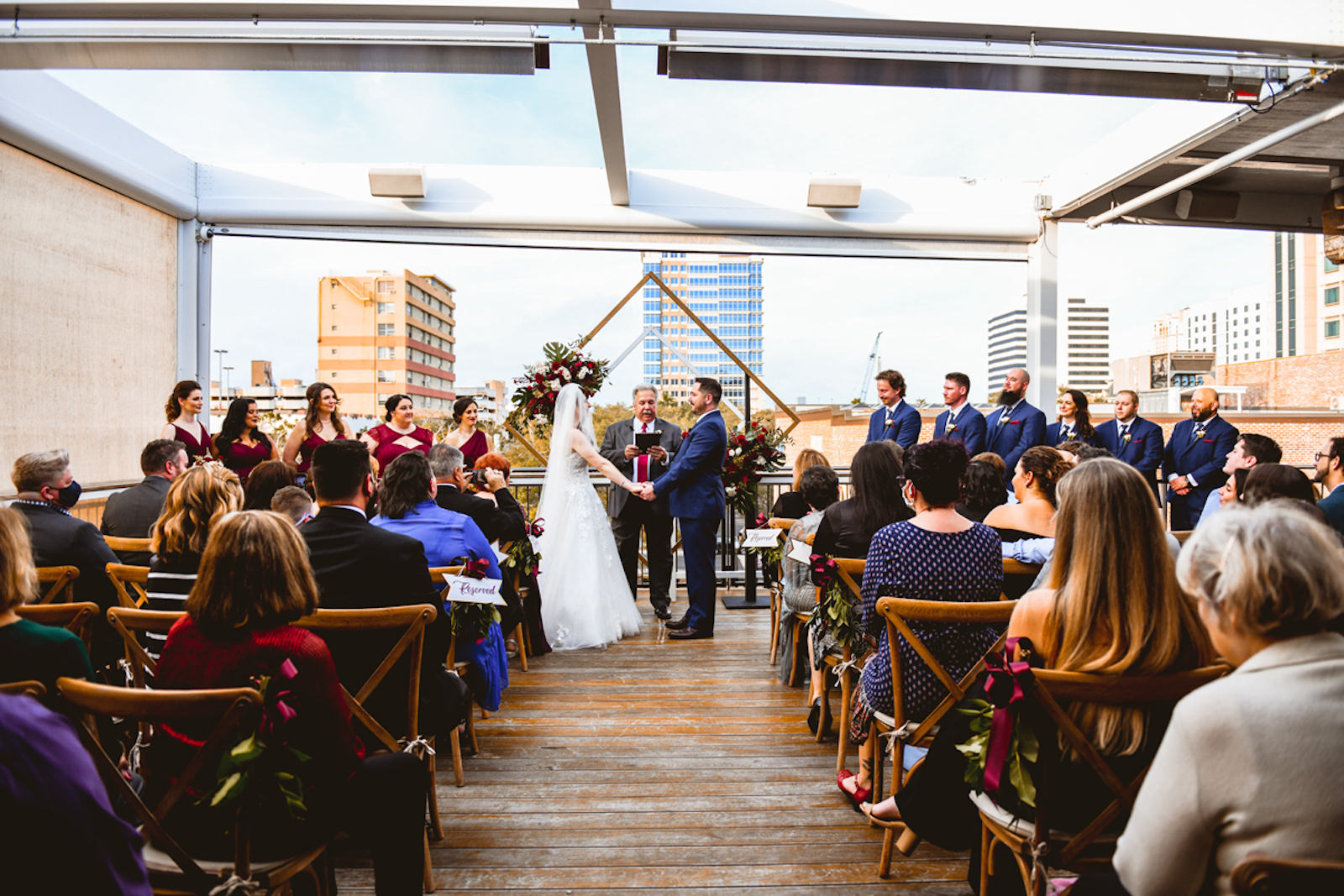 Bride and Groom Exchanging Wedding Vows During Rooftop Ceremony in Front of Geometric Sculpture | Tampa Bay Wedding Planner Special Moments Event Planning | St. Pete Wedding Venue Red Mesa Events