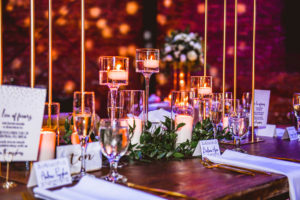 Industrial Wedding Reception Decor, Wooden Table with Floating Candles, Hurricane Candles, Greenery