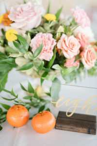 Tropical Wedding Reception Decor, Tangerine Oranges, Acrylic and Gold Script Table Number, Colorful Floral Bouquet with Pink, White and Orange Flowers | Tampa Bay Wedding Planner Coastal Coordinating