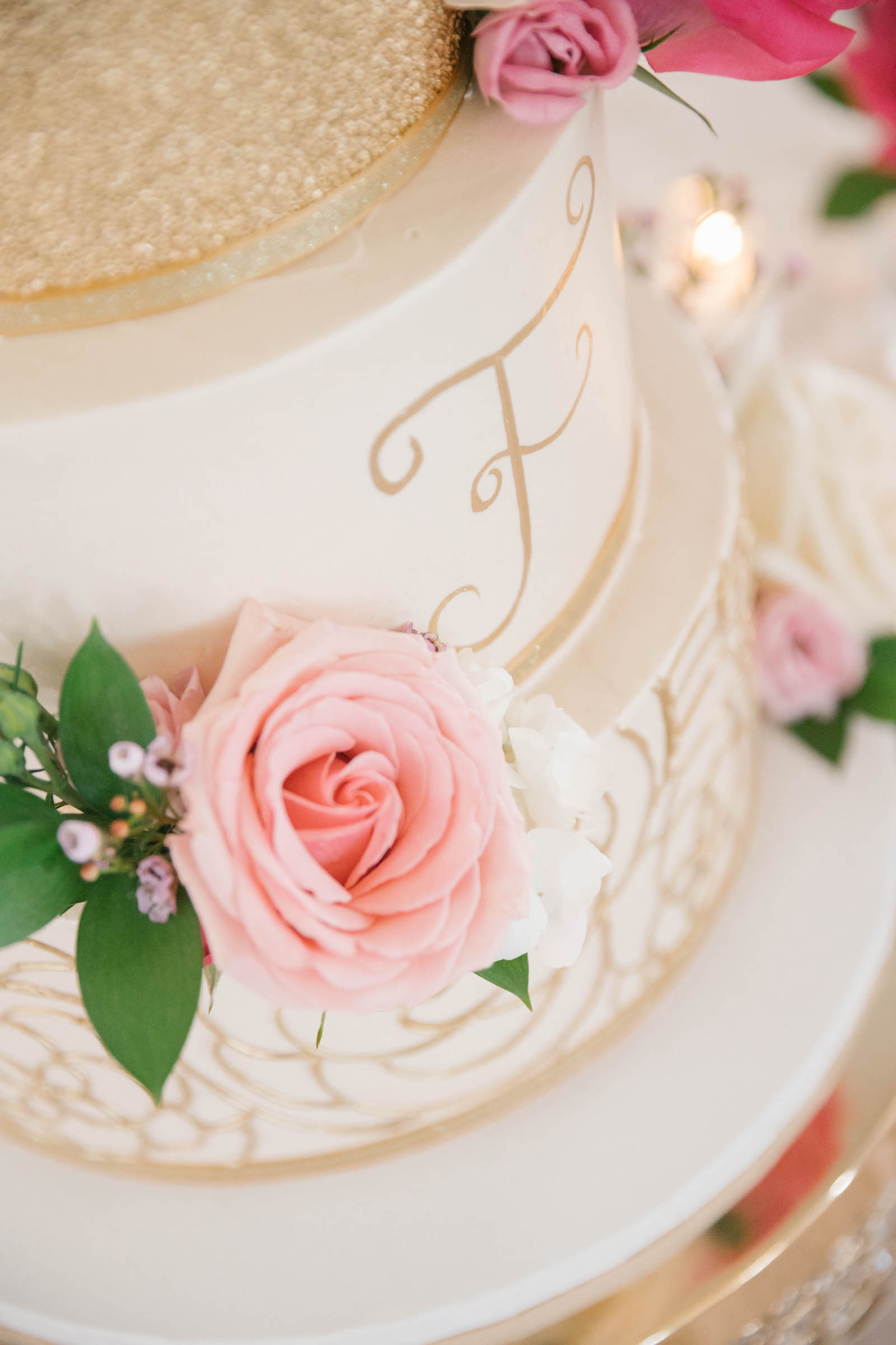 Three Tier White and Gold Wedding Cake with Script Monogram Lettering with Vibrant Pink Roses on Crystal and Gold Cake Stand | Tampa Bay Wedding Planner Parties A'la Carte | Wedding Cake The Artistic Whisk