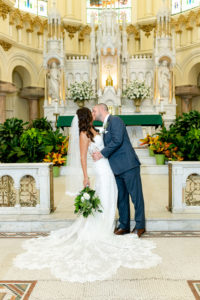 Bride and Groom Portrait at Sacred Heart Catholic Church | Lace Strapless Sweetheart Scalloped Edge Train Wedding Dress Bridal Gown | Groom Wearing Classic Navy Suit | Dewitt for Love Photography