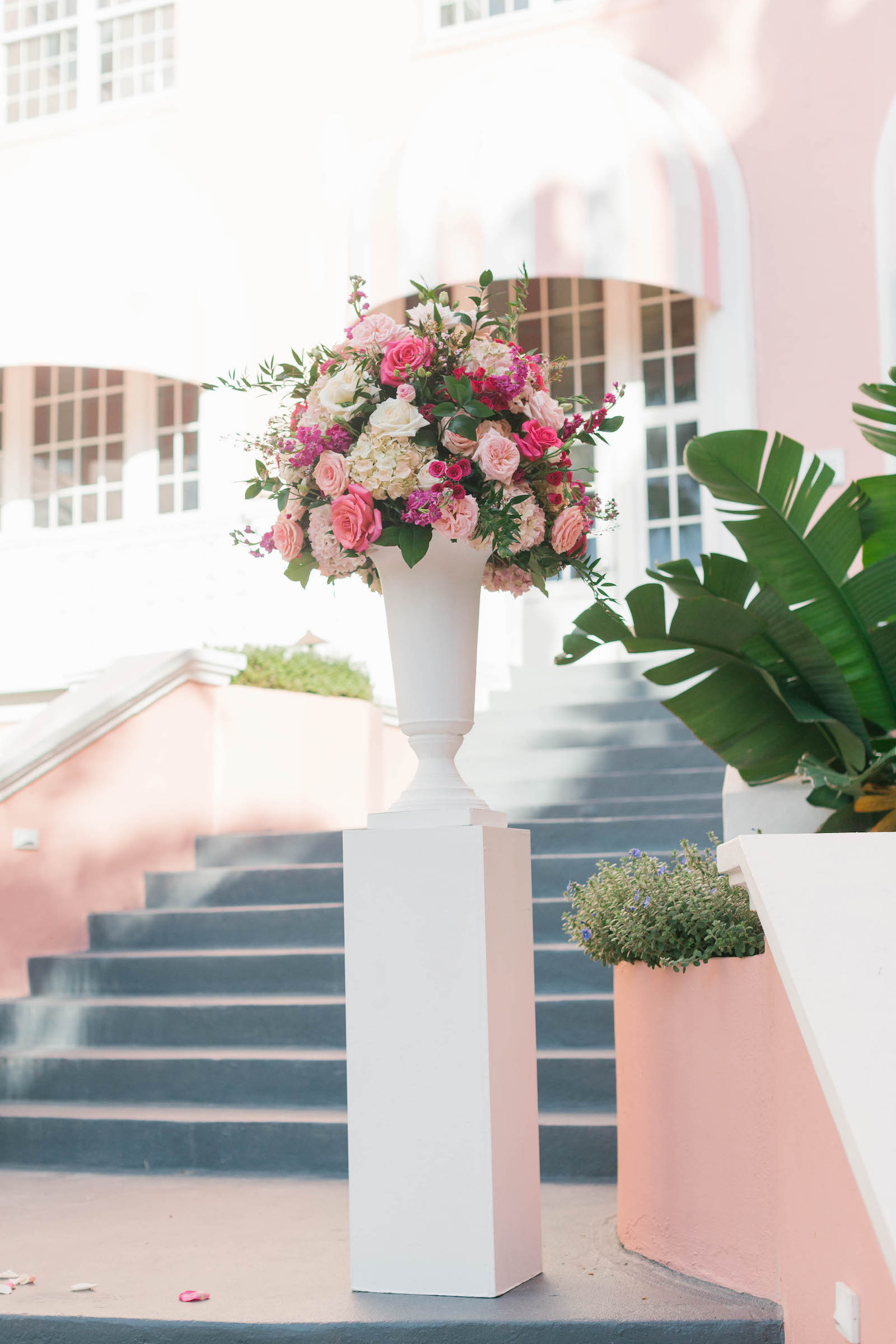 Elegant Wedding Ceremony Decor, Tall White Pedestal with Lush Vibrant Pink, White and Purple Floral Arrangement | Tampa Bay Wedding Florist Bruce Wayne Florals | Wedding Planner Parties A'la Carte