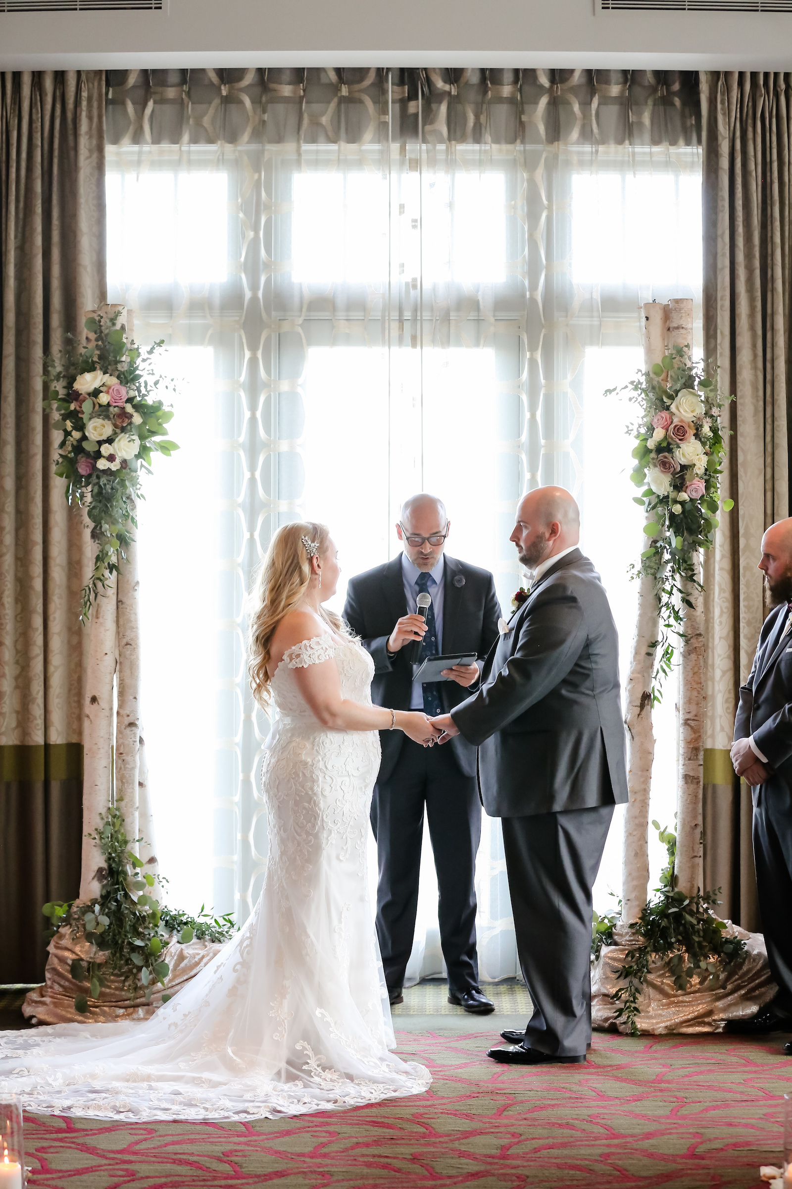 Classic Bride and Groom Exchanging Wedding Vows During Ballroom Ceremony, Birch Wooden Stands with Floral Arrangements | Tampa Bay Wedding Planner Kelly Kennedy Weddings and Events | St. Pete Wedding Venue The Birchwood | Wedding Photographer Lifelong Photography Studio