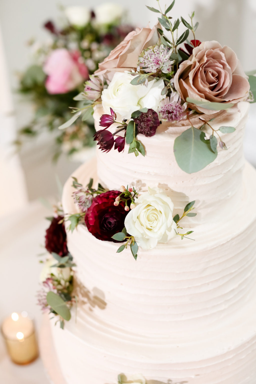 Classic Three Tier Textured Wedding Cake with Jewel Tone Flowers, Ivory, Dusty Rose Mauve, Burgundy Red Roses | Tampa Bay Florist Monarch Events and Design | Wedding Photographer Lifelong Photography Studio