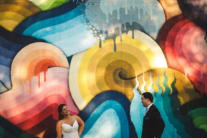 Creative Bride and Groom in Front of Colorful Mural in St. Petersburg
