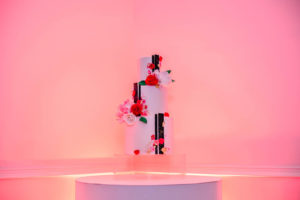 Valentine Inspired Three Tier White Cake with Black Stripes Wedding Cake with Red, White and Pink Sugar Flowers | Tampa Bay Cake Company