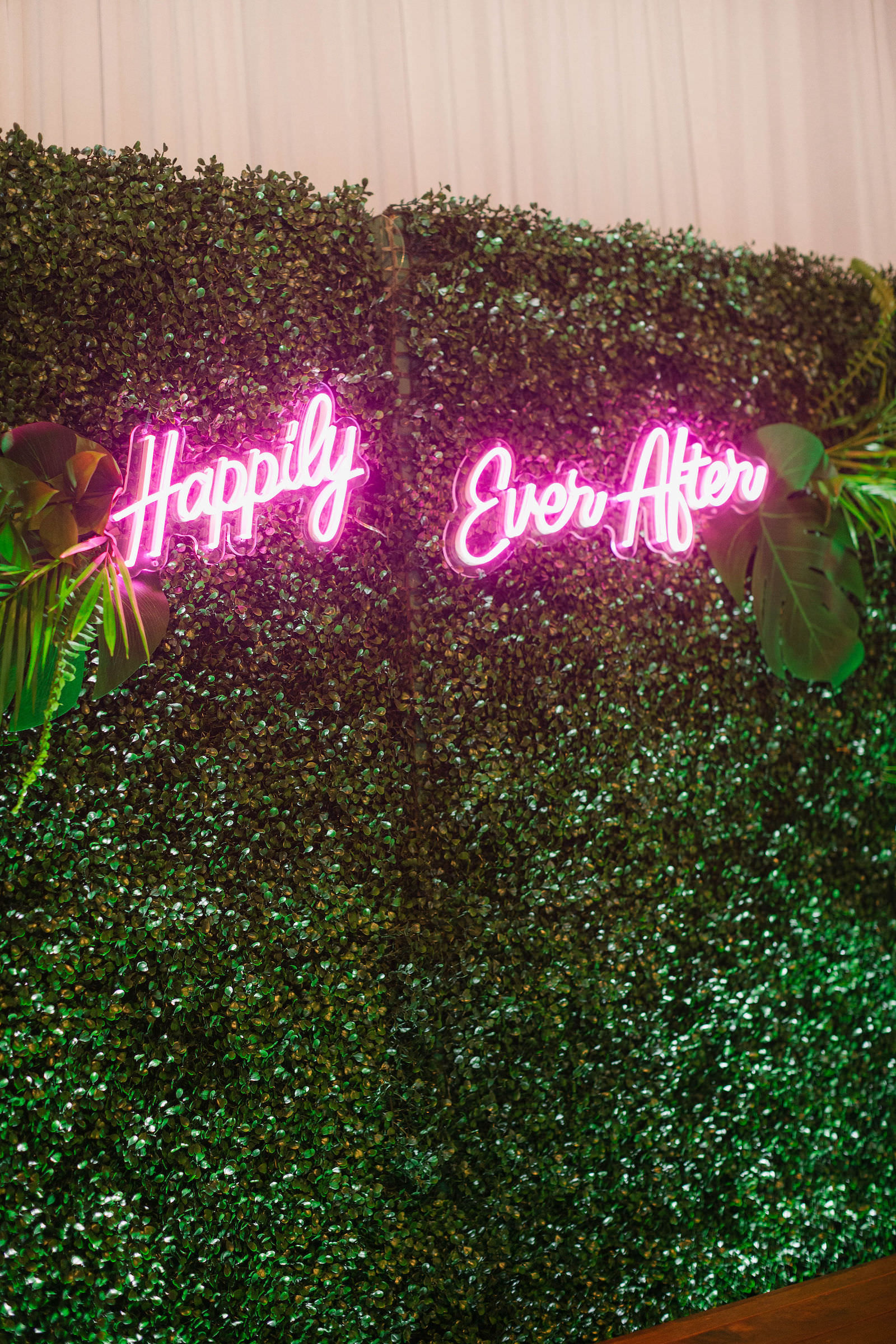 Greenery Boxwood Sweetheart Table Backdrop with Neon Happily Ever After Sign Tropical Destination Beach Wedding Inspiration | Bellwether Beach Resort Styled with Love by Marry Me Tampa Bay