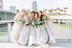 Bride in Wtoo by Watters Lace and Illusion Crepe Off the Shoulder Wedding Dress, Bridesmaids in Mix and Match Gray Dresses | Tampa Bay Wedding Photographer Kera Photography | Wedding Hair and Makeup Femme Akoi | St. Pete Pier Bridal Party Portrait