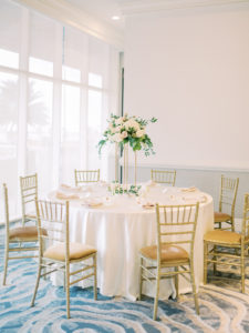 Timeless Romantic Wedding Reception Decor, Round Table with White Linen, Gold Chiavari Chairs, Tall White Floral and Greenery Centerpiece | Tampa Bay Wedding Planner Special Moments Event Planning | Wedding Venue Hyatt Regency Clearwater Beach | Wedding Rentals Kate Ryan Event Rentals