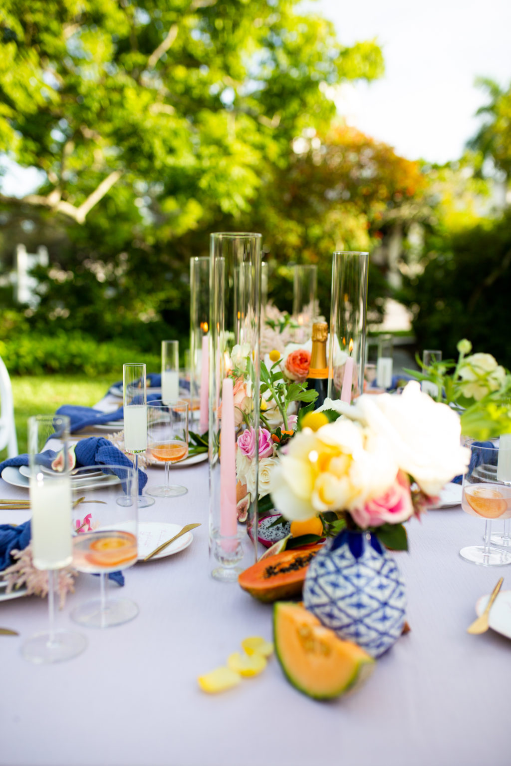 Tampa Bay Garden Inspired Intimate Wedding Ceremony at Sarasota Garden Club, Florida Micro Wedding Style Shoot with Silver Linens, Citrus Orange and Peach Florals, Pops of Dark Blue Blue, Gold Flatware, Light Pink Florals in Outdoor Venue