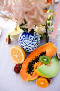 Citrus Inspired Florida Wedding Reception Decor, Fresh Fruit with Pastel Pink Florals, Dark Blue and White China Vase