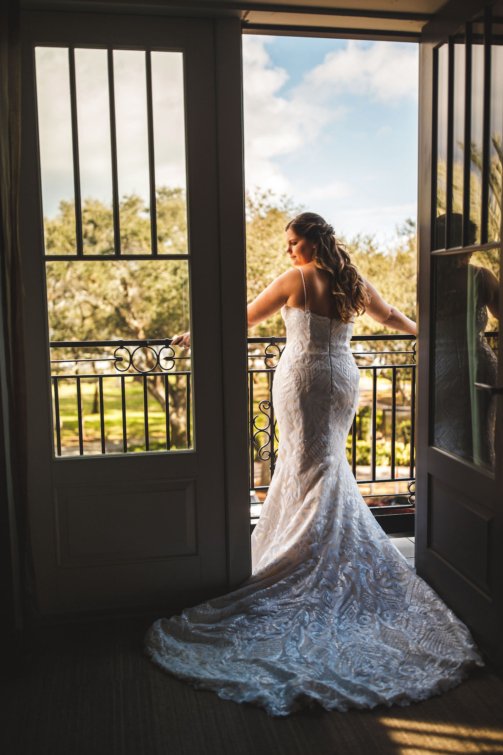 Tampa Bride on Balcony of Hotel Wearing Casablanca Bridal Lace Fit and Flare Wedding Dress | St. Pete Wedding Venue The Birchwood
