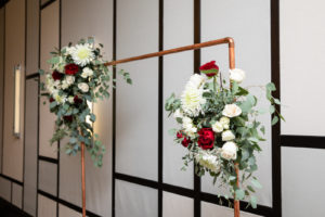 Timeless Wedding Reception Decor, Copper Arch with Eucalyptus Greenery, Ivory and Red Floral Arrangements | Tampa Bay Wedding Planner Elegant Affairs by Design