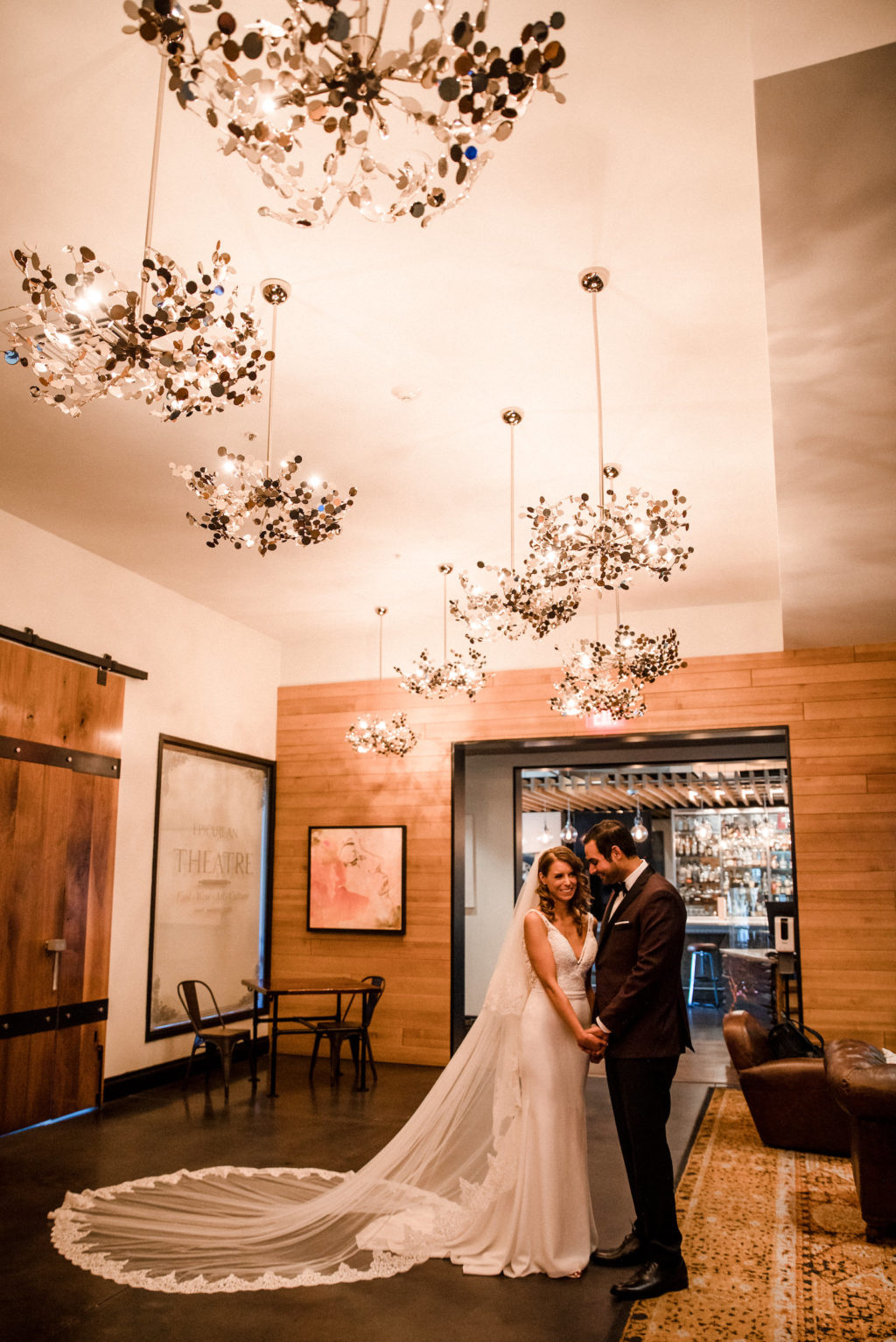 Timeless Tampa Bride in Full Length Lace Trim Veil and Groom in Lobby of Wedding Venue Epicurean Hotel | Elegant Affairs by Design