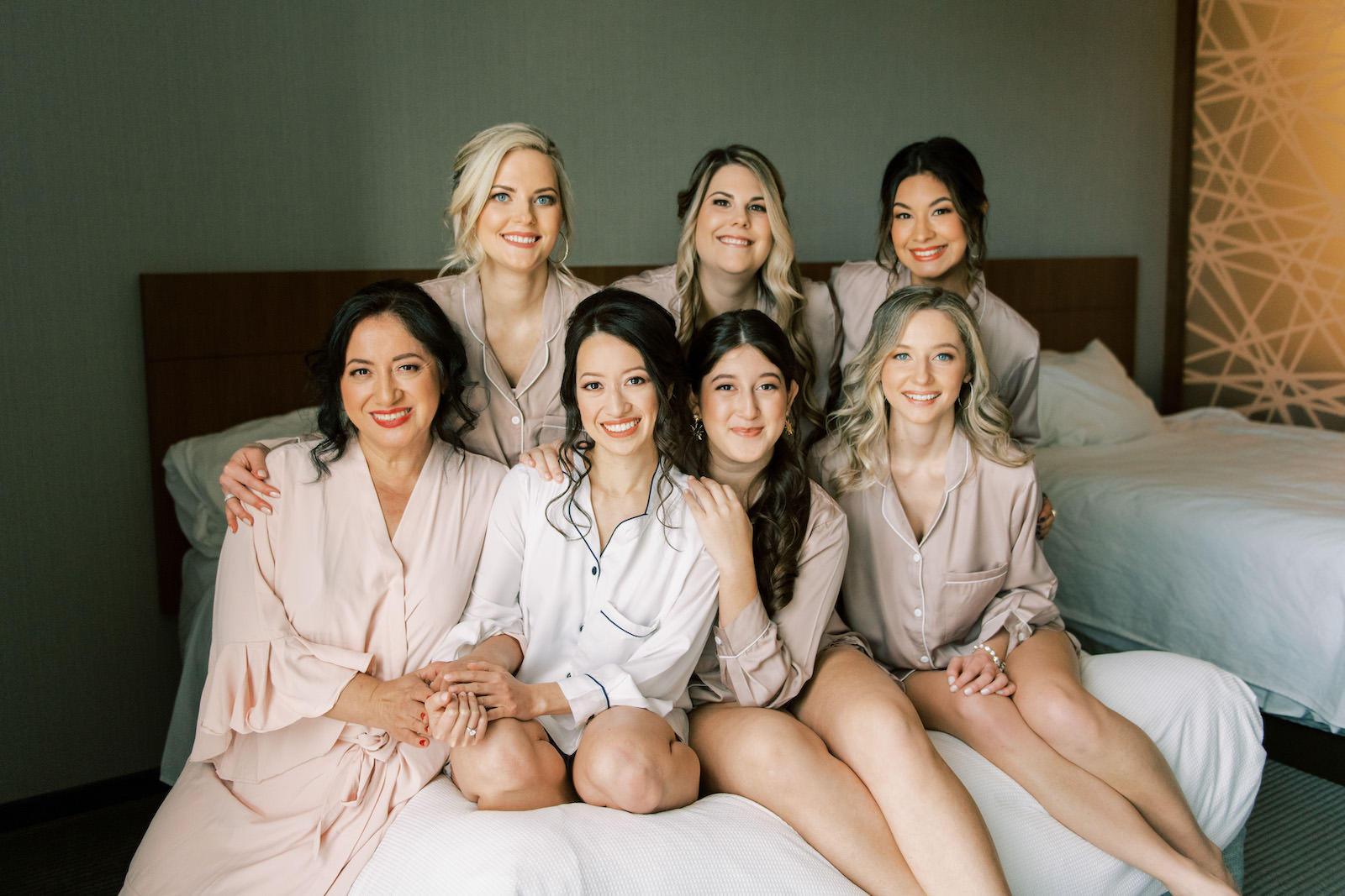 Bride and Bridesmaids in Matching Pajamas Getting Ready Picture