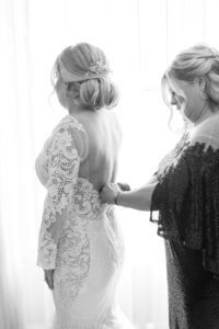 Bride Getting Ready in Lace and Illusion Open Back Wedding Dress