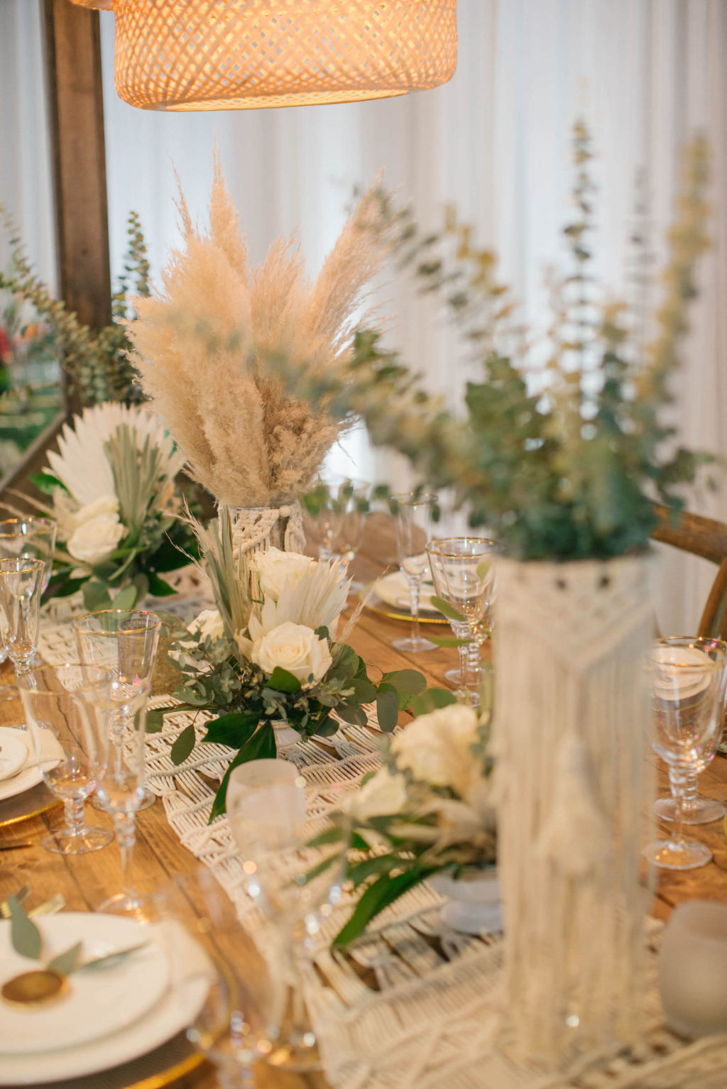 Boho Pampas Grass and Eucalyptus Greenery Centerpieces with Macrame Table Runner | Reception Decor Ideas and Inspiration | Styled With Love at St. Pete Beach Wedding Venue Bellwether Beach Resort