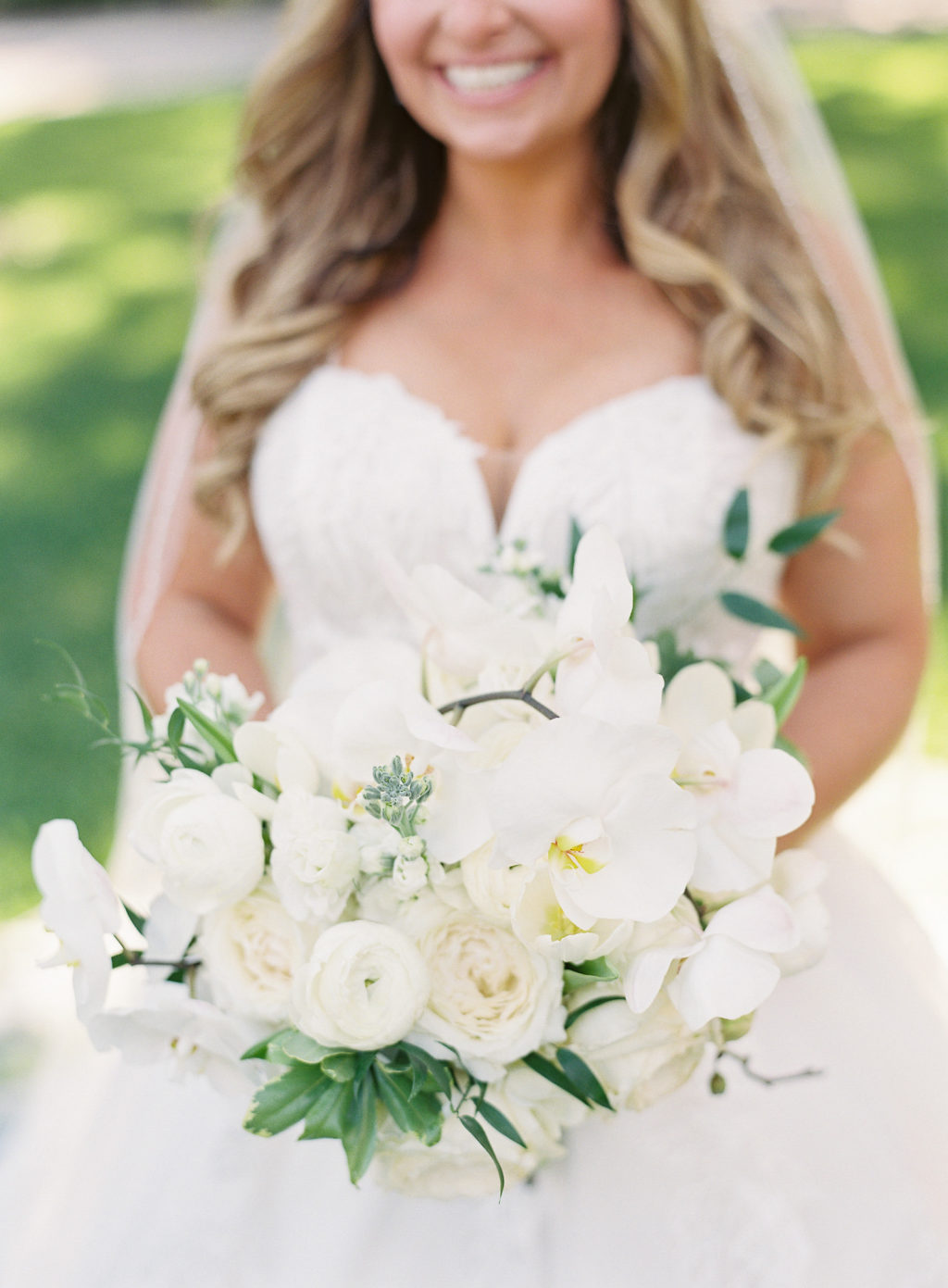 Classic Tampa Bay Bride Holding White Orchid, Roses Floral Bouquet