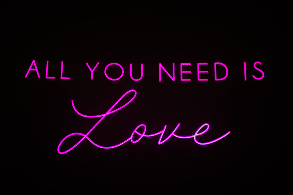 Urban and Edgy Wedding Decor, Pink Neon Sing " All You Need Is Love" | Tampa Bay Wedding Photographer Bonnie Newman Creative | Wedding Planner and Designer UNIQUE Weddings + Events | Wedding Lighting Spark Weddings and Events