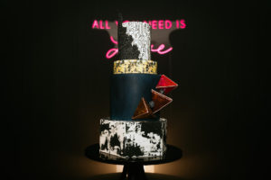 Unique Edgy and Urban Black, White, and Gold Round and Geometric Wedding Cake with Art Deco Inspo Design, Red 3D Geometric Triangles | Tampa Wedding Photographer Bonnie Newman Creative | Wedding Cake The Artistic Whisk | Wedding Designer and Planner UNIQUE Weddings + Events