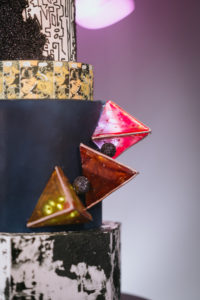 Unique Edgy and Urban Black, White, and Gold Round and Geometric Wedding Cake with Art Deco Inspo Design, Red 3D Geometric Triangles | Tampa Wedding Photographer Bonnie Newman Creative | Wedding Cake The Artistic Whisk | Wedding Designer and Planner UNIQUE Weddings + Events