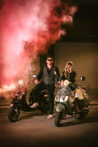 Urban and Edgy Bride in Leather Jacket on Silver Moto Scooter, Groom in Black Dress Shirt and Pants with Gray Vest on Black Scooter and Pink Smoke Bomb | Tampa Bay Wedding Photographer Bonnie Newman Creative | Wedding Designer and Planner UNIQUE Weddings + Events