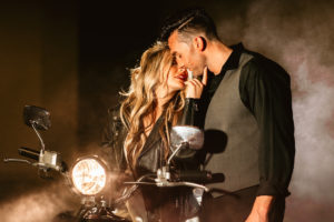Urban and Edgy Bride in Leather Jacket with Groom in Black Dress Shirt and Gray Vest Intimate on Scooter | Tampa Bay Wedding Photographer Bonnie Newman Creative | Wedding Hair and Makeup Adore Bridal Services