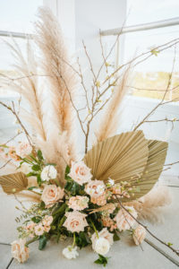 Organic Boho Modern White and Brown Wedding Ceremony Flowers with Peach Roses, Gold Leaves, and Feathers | Tampa Bay Wedding Florist Monarch Events
