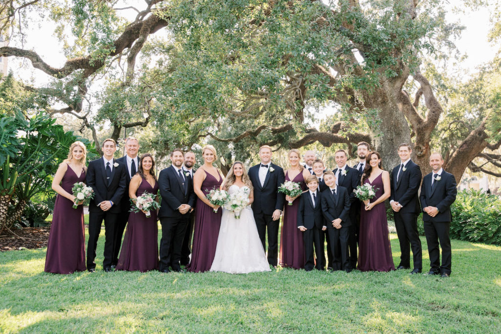 Traditional Bride and Groom, Bridesmaids in Plum Purple Matching Dresses, Groomsmen in Black Suits, Wedding Party Portrait