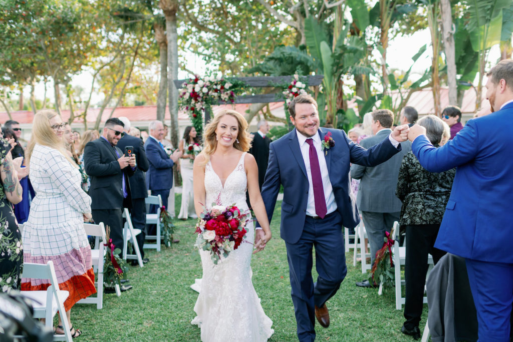 Tampa Bay Bride and Groom Exit From Wedding Ceremony | Clearwater Wedding Venue Carlouel Beach and Yacht Club