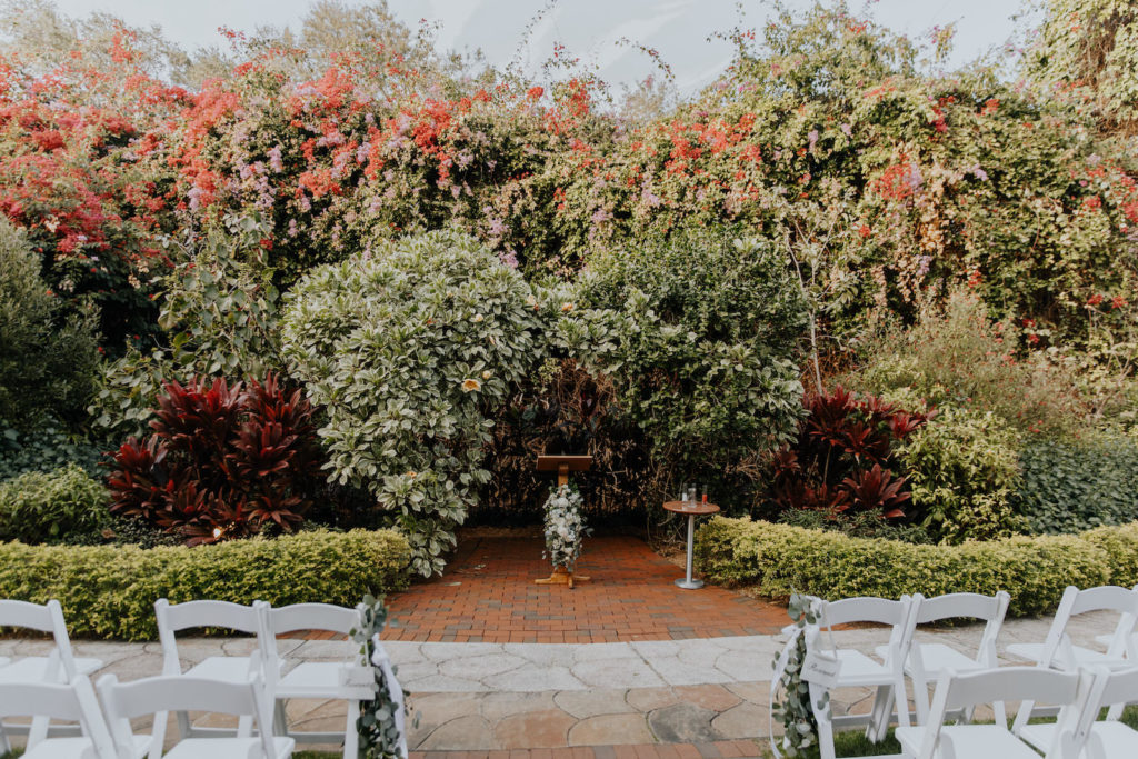 Downtown St. Petersburg Outdoor Wedding Ceremony with White Floral Bouquets and Greenery | Sunken Gardens