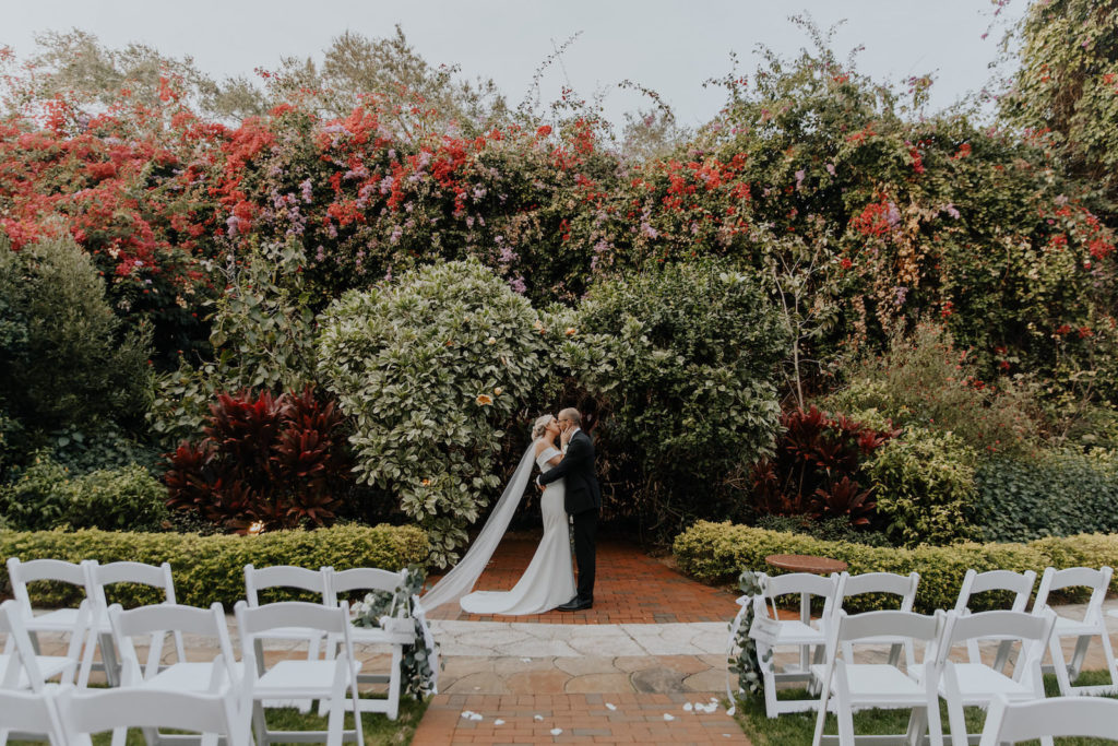 Outdoor Bride and Groom Embracing Wedding Portrait | St. Pete Garden Wedding Ceremony