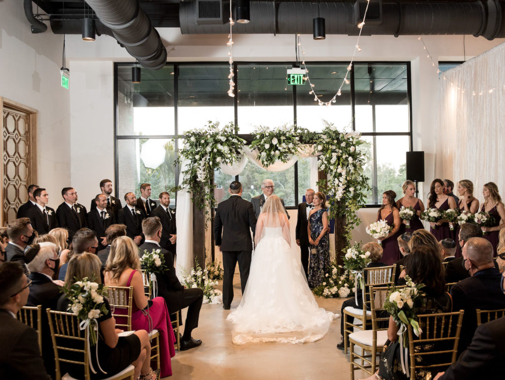 Traditional Wedding Ceremony, Bride and Groom Under White Linen, Greenery and White Floral Arrangements Chuppah | Tampa Bay Wedding Venue Hyde House