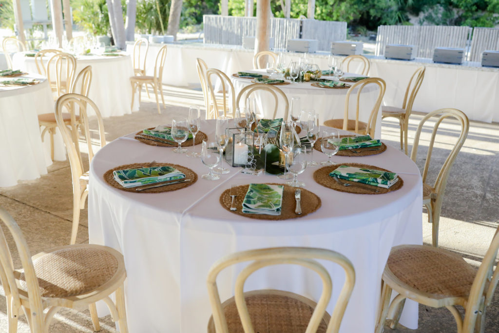 Tropical Wedding Reception Decor, Round Tables with White Linen Tablecloths, Palm Leaf Linen Napkins, Bamboo Chairs | Tampa Bay Wedding Photographer Lifelong Photography Studio | St. Pete Wedding Venue Postcard Inn on the Beach
