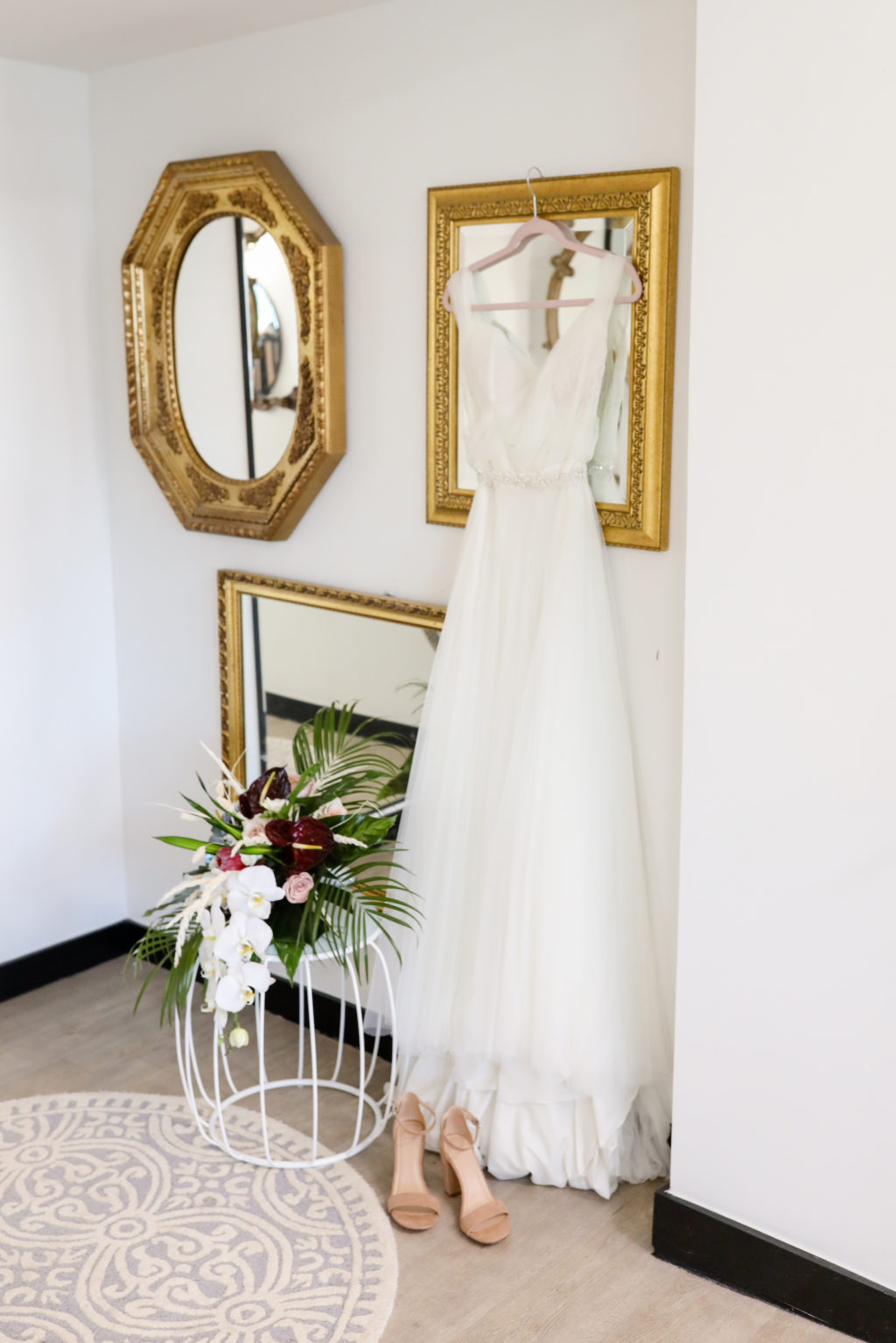 Boho Tulle Wedding Dress Hanging on Frame, Tropical White Orchids and Burgundy Floral with Palm Fronds Bouquet, Nude Wedding Shoes | Tampa Bay Wedding Photographer Lifelong Photography Studio | Wedding Florist Iza's Flowers