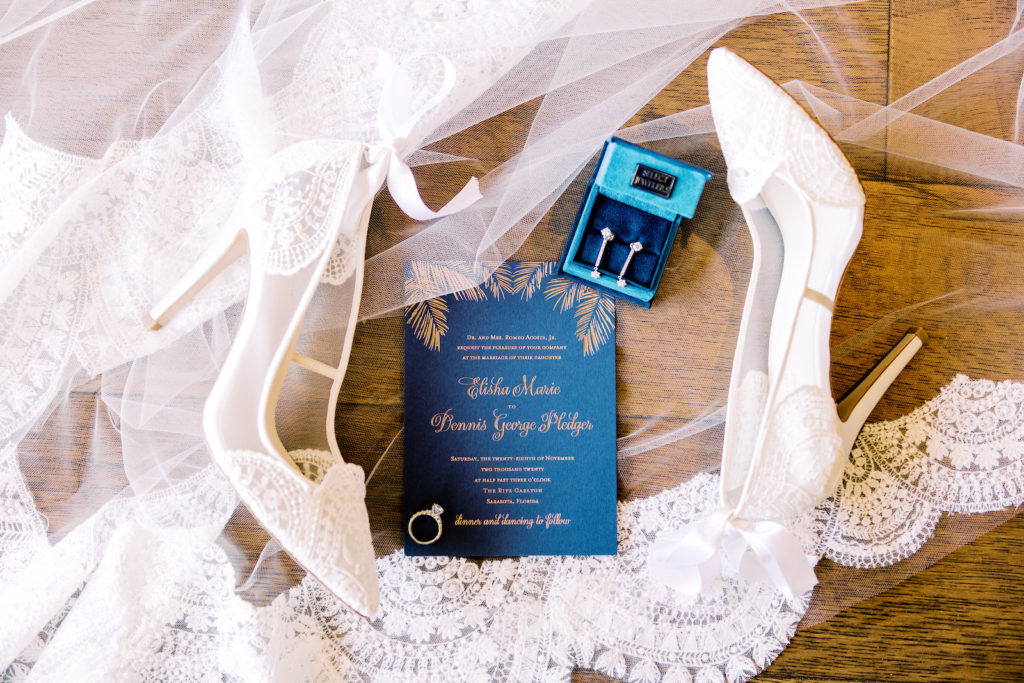 Elegant Tropical Blue and Gold Palm Tree Leaves Wedding Invitation, Bridal Accessories, Lace and Illusion with Satin Bow White Pointed Toe Wedding Shoes, Drop Diamond Earrings, Lace Wedding Veil | Tampa Bay Wedding Photographer Kera Photography | Wedding Invitations A&P Designs Co