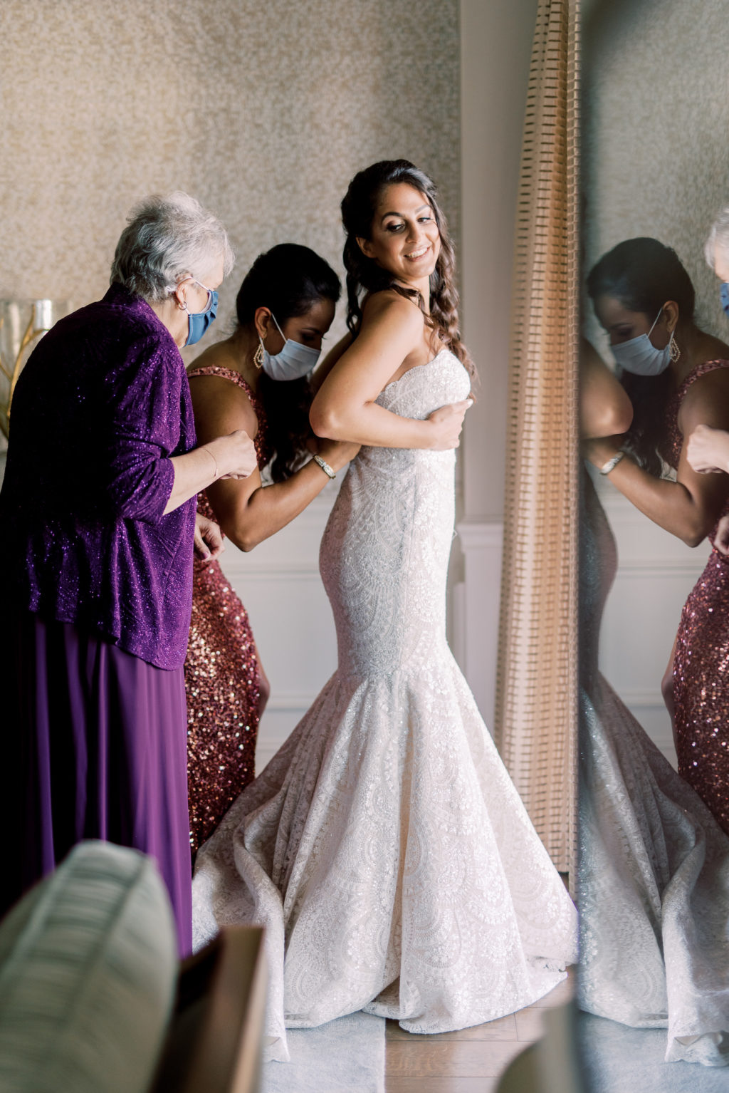 Florida Bride Putting on Mermaid Beaded Wedding Dress | Tampa Bay Wedding Photographer Kera Photography