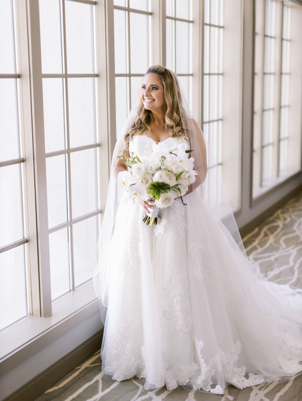 Traditional Tampa Bride in Lace and Tulle Ballgown Wedding Dress Holding Classic White Floral Bouquet