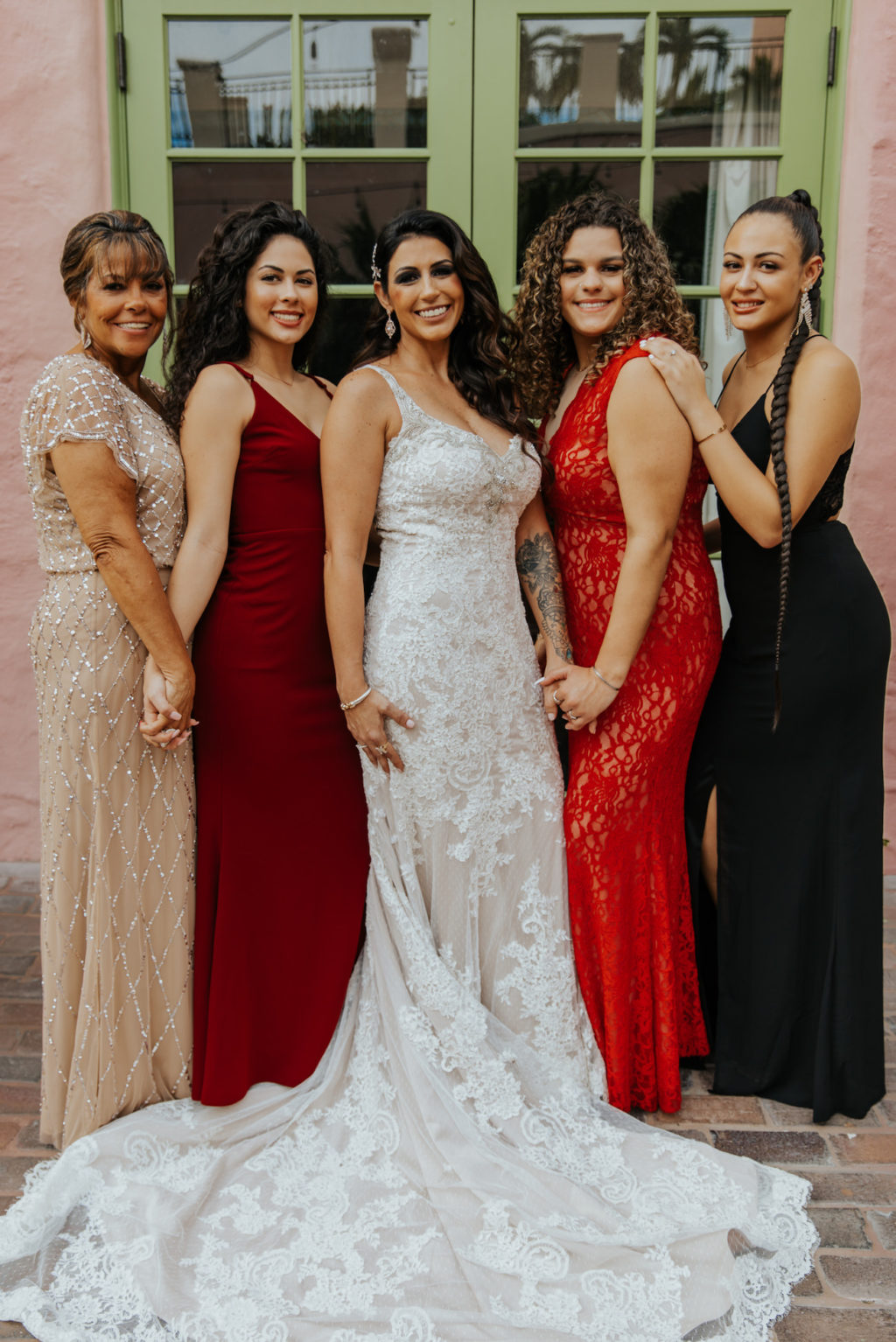 Outdoor Bridal Party Portrait | Bride Wearing an Illusion Lace V Neck Sheath Bridal Gown Wedding Dress with Champagne Liner by Ashley and Justin Bride | Bridesmaids in Mismatched Dresses