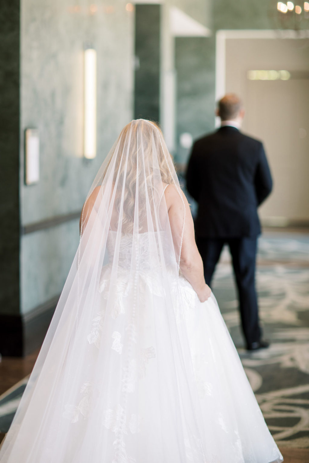 Tampa Bride in Full Length Tulle Veil First Look Photo with Groom