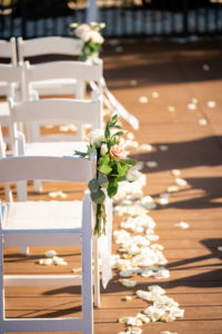 Mauve and Ivory Rose with Greenery Small Floral Arrangement on Folding White Chair for Wedding Ceremony Decor, White Flower Petals | Tampa Bay Wedding Florist Iza's Flowers