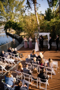 Florida Bride and Groom Exchanging Wedding Vows During Outdoor Courtyard Ceremony | St. Pete Wedding Venue Hotel Zamora