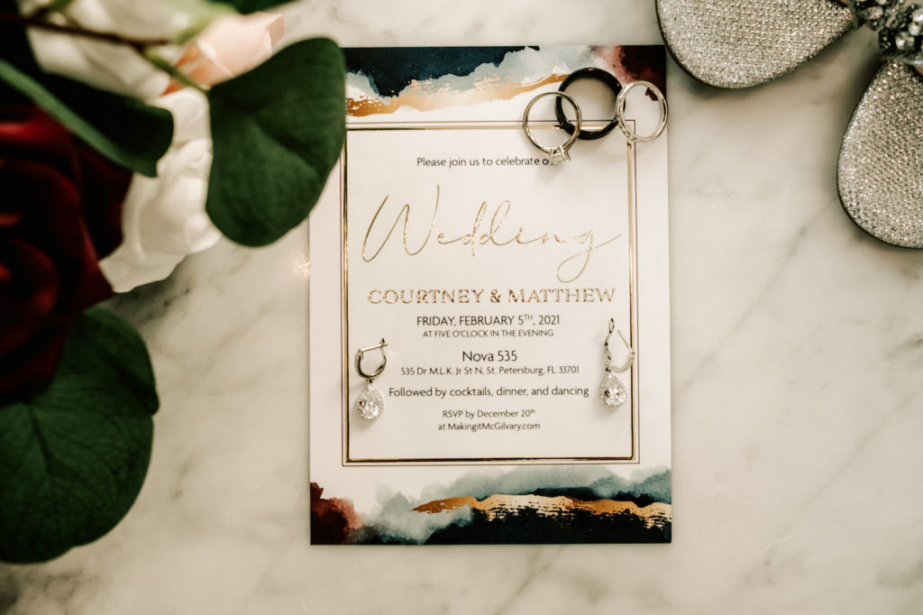 Industrial Inspired Wedding Invitation At NOVA 535 in Downtown St. Pete | Moody color palette with burgundy, navy and gold , with Wedding Bands and Diamond Tear Drop Florida Bridal Accessories