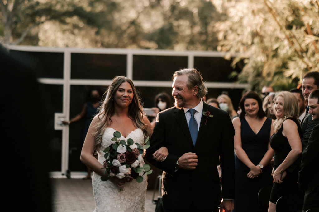 Romantic Florida Bride and Father Walk Down the Aisle During Wedding Processional, Bride Wearing Sweetheart Neckline Wedding Dress with Embroidery | Unique Florida Wedding Venue NOVA 535