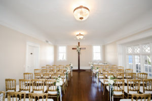 Classic Wedding Ceremony Decor, Wooden Cross at Altar, Gold Chairs with White Floral Bouquets | Tampa Bay Wedding Photographer Lifelong Photography Studio | Wedding Rentals A Chair Affair | Kate Ryan Event Rentals