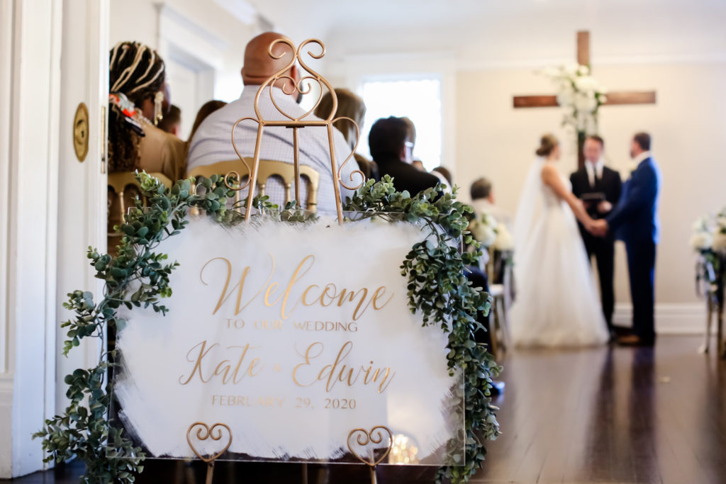 Classic Modern Acrylic and Gold Wedding Welcome Sign with Greenery Garland | Tampa Bay Wedding Photographer Lifelong Photography Studio | Wedding Planner Core Concepts | Wedding Rentals Kate Ryan Event Rentals | A Chair Affair