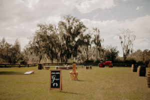 Rustic Wedding Reception Decor, Chalkboard Welcome Sign, Red Tractor | Plant City Wedding Venue Florida Rustic Barn Weddings
